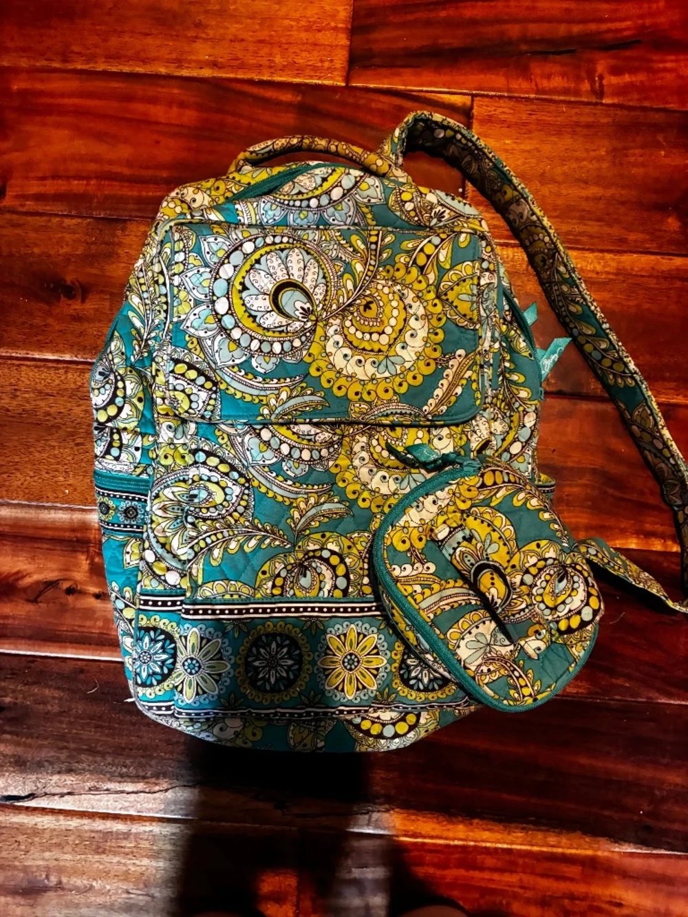 Peacock green Vera Bradley backpack with little necessity pouch